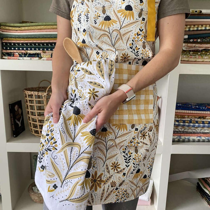 Bee Garden Apron & Tea Towel—bake in style with gingiber apron featuring bee and floral print and matching tea towel, adjustable neck strap, large pocket, 100% cotton canvas