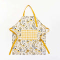 Bee Garden Apron—bake in style with gingiber apron featuring bee & floral print, adjustable neck strap, large pocket, 100% cotton canvas
