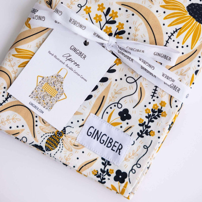Bee Garden Apron—bake in style with gingiber apron featuring bee & floral print, adjustable neck strap, large pocket, 100% cotton canvas