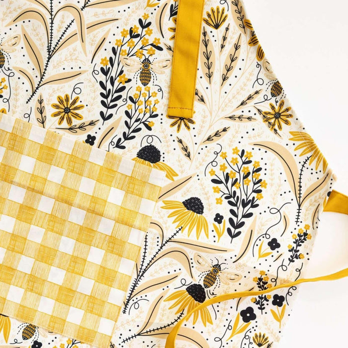 Bee Garden Apron—bake in style with gingiber apron featuring bee & floral print, adjustable neck strap, large pocket, 100% cotton canvas