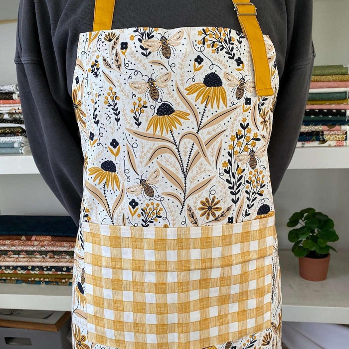 Bee Garden Apron—bake in style with gingiber apron featuring bee & floral print, adjustable neck strap, large pocket, 100% cotton canvas