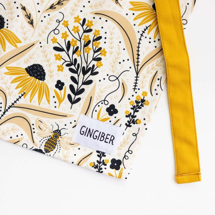Bee Garden Apron—bake in style with gingiber apron featuring bee & floral print, adjustable neck strap, large pocket, 100% cotton canvas