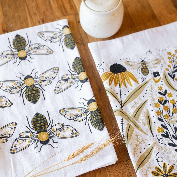 tea towel with illustrated bees and floral elements