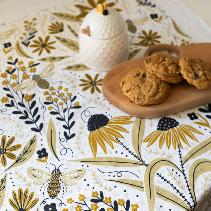 tea towel with illustrated bees and floral elements