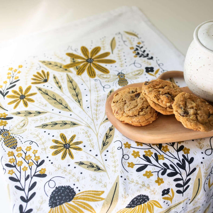 tea towel with illustrated bees and floral elements