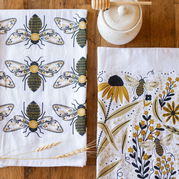 tea towel with illustrated bees and floral elements