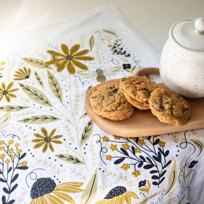 tea towel with illustrated bees and floral elements