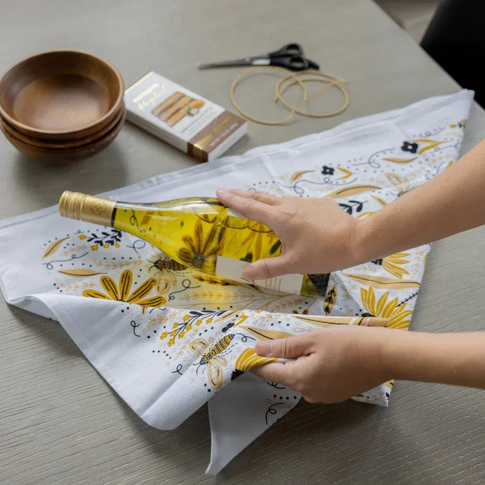 tea towel with illustrated bees and floral elements