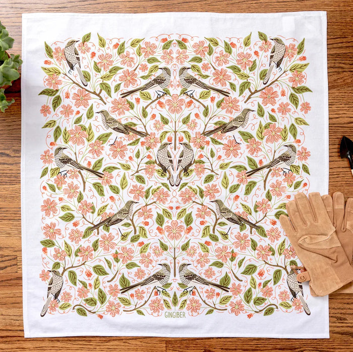 tea towel with illustrated birds and floral elements