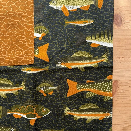 Fabric with fish pattern on a dark background