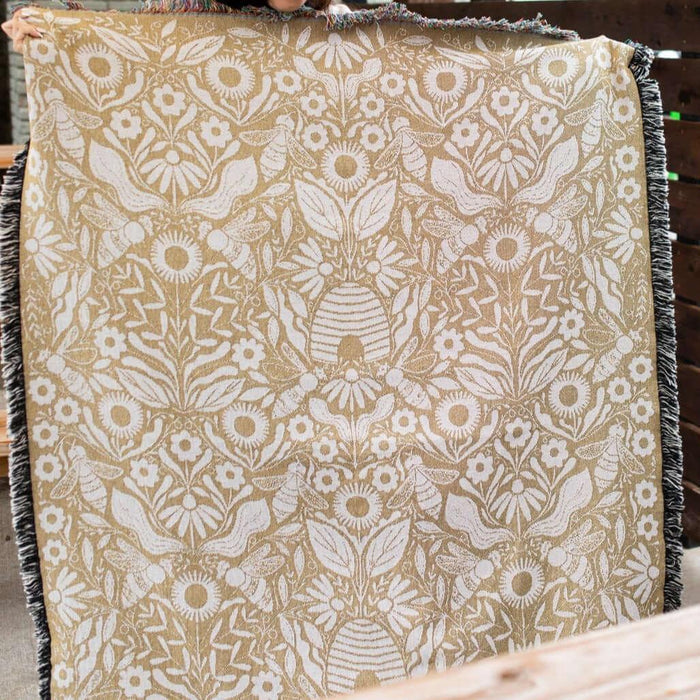 Blanket - woven throw featuring gold bee and beehive illustrations