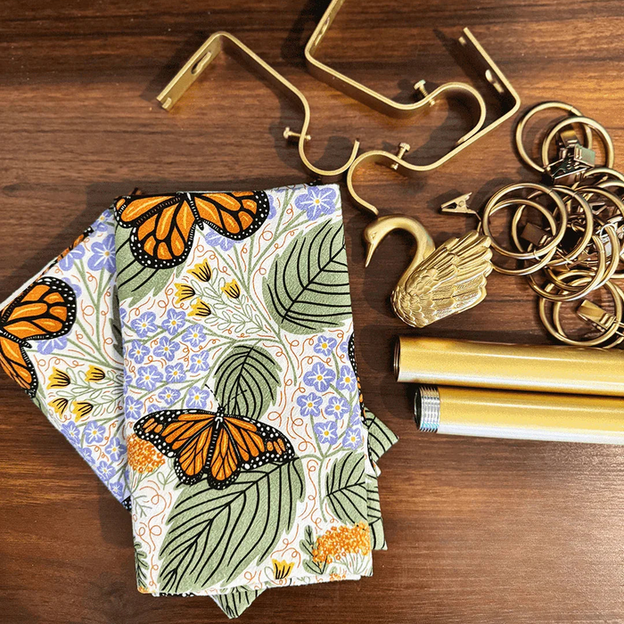 set of two tea towels with butterfly and floral illustrations