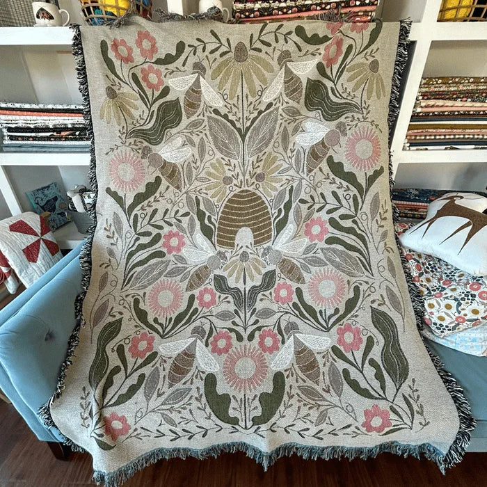 Blanket - woven throw featuring multicolored bee and beehive illustrations
