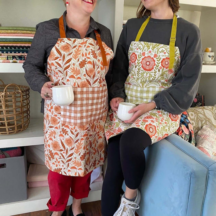 Mushroom Medley Apron—bake in style with gingiber apron featuring mushroom print, adjustable neck strap, large pocket, 100% cotton canvas