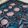 blanket with pink and dark blue floral designs