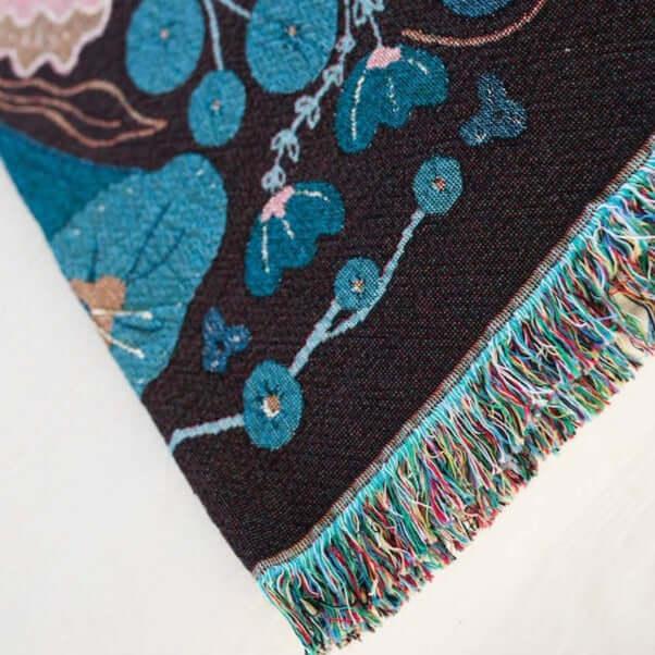 blanket with pink and dark blue floral designs