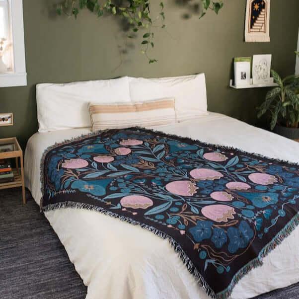 blanket with pink and dark blue floral designs